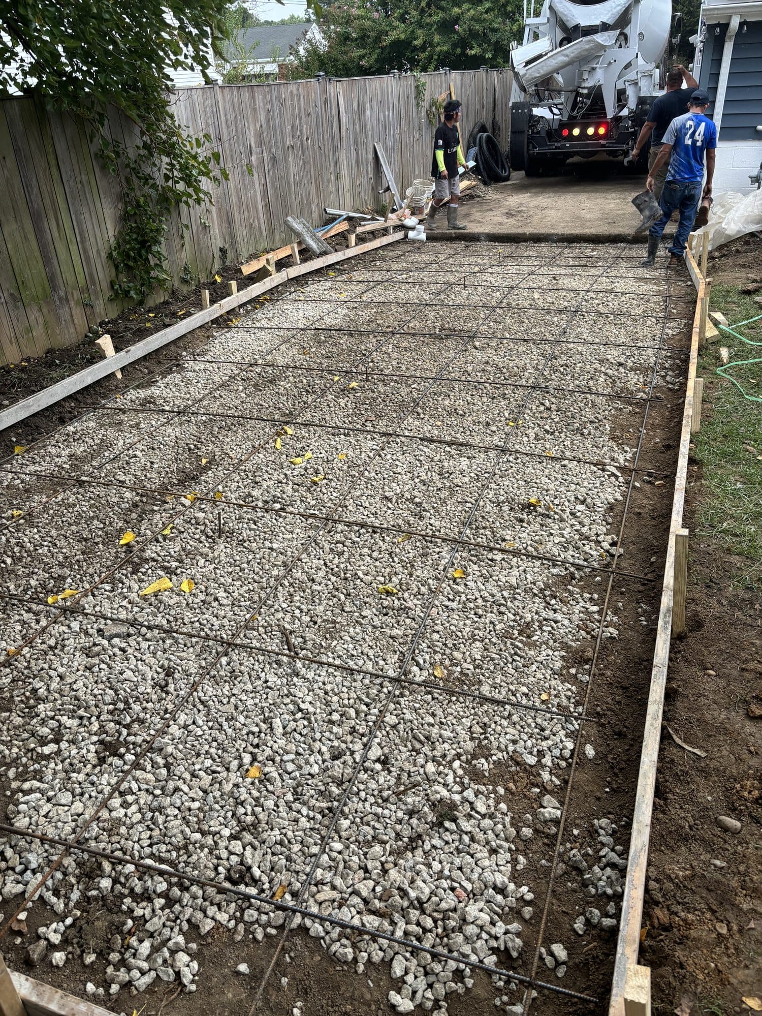 Driveway prep with rebar grid and gravel base. Concrete project by Potts Brothers Construction, Arlington & Northern Virginia