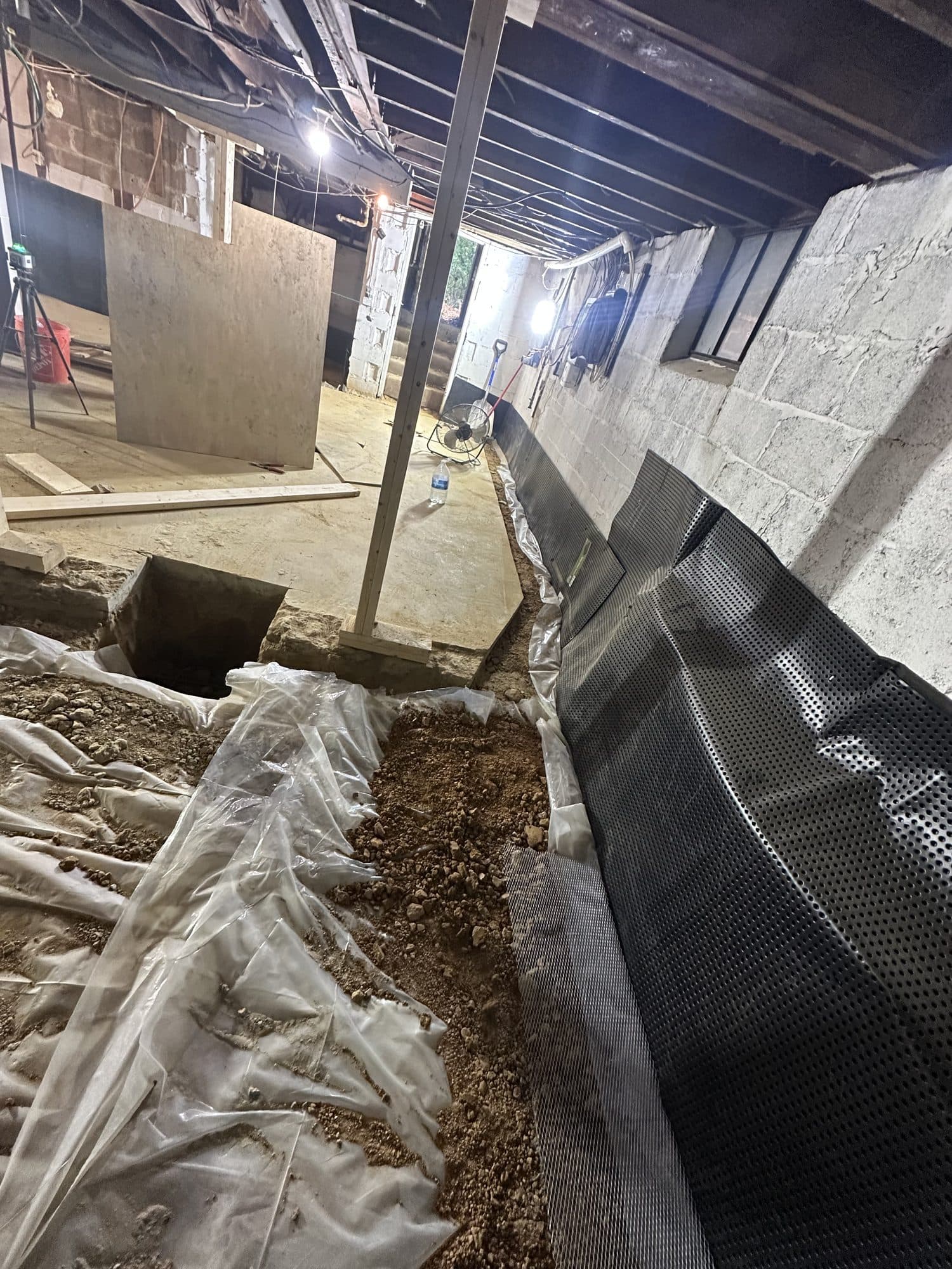 Basement perimeter trench with a dimple drainage board. Foundation project by Potts Brothers Construction, Arlington & Northern Virginia