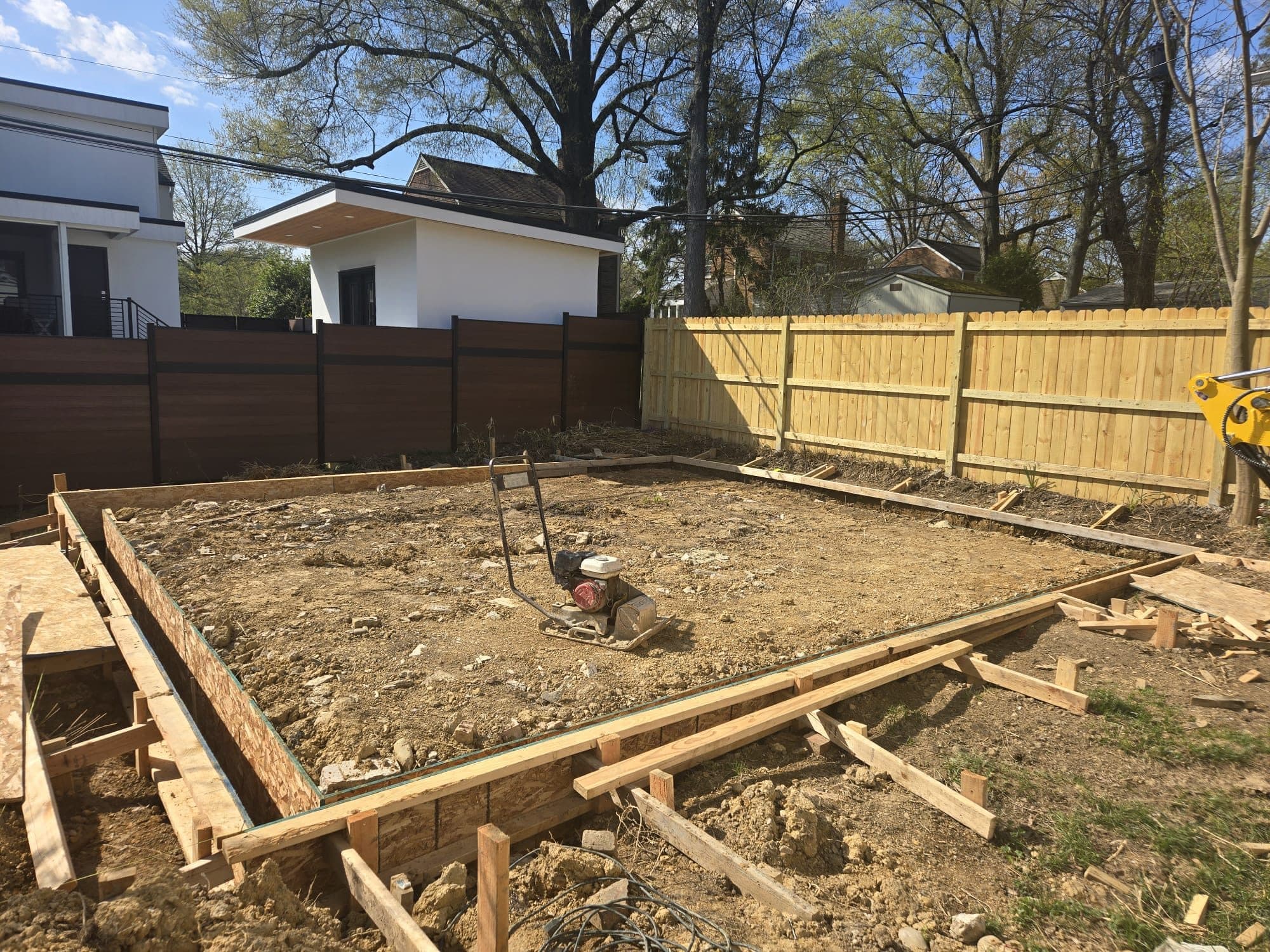 Wood formwork laid out for slab foundation in backyard. Foundation project by Potts Brothers Construction, Arlington & Northern Virginia
