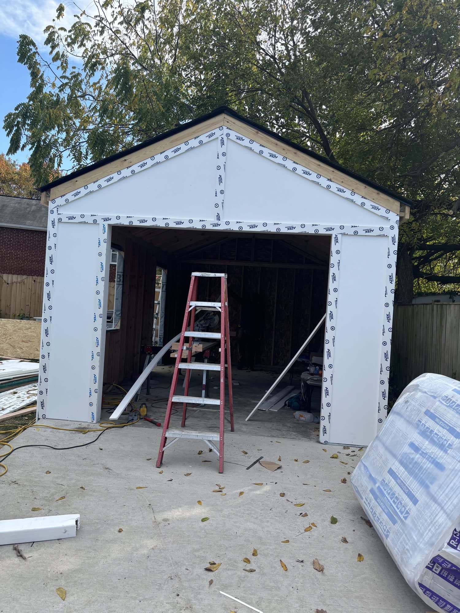 Garage opening framed with taped weather barrier sheathing. Garage project by Potts Brothers Construction, Arlington & Northern Virginia